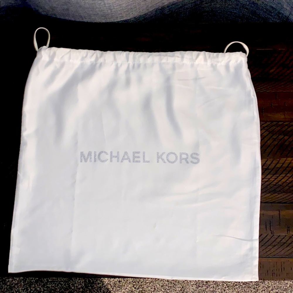 Michael Kors white satin dust bag.